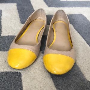 Yellow and tan ballet flats